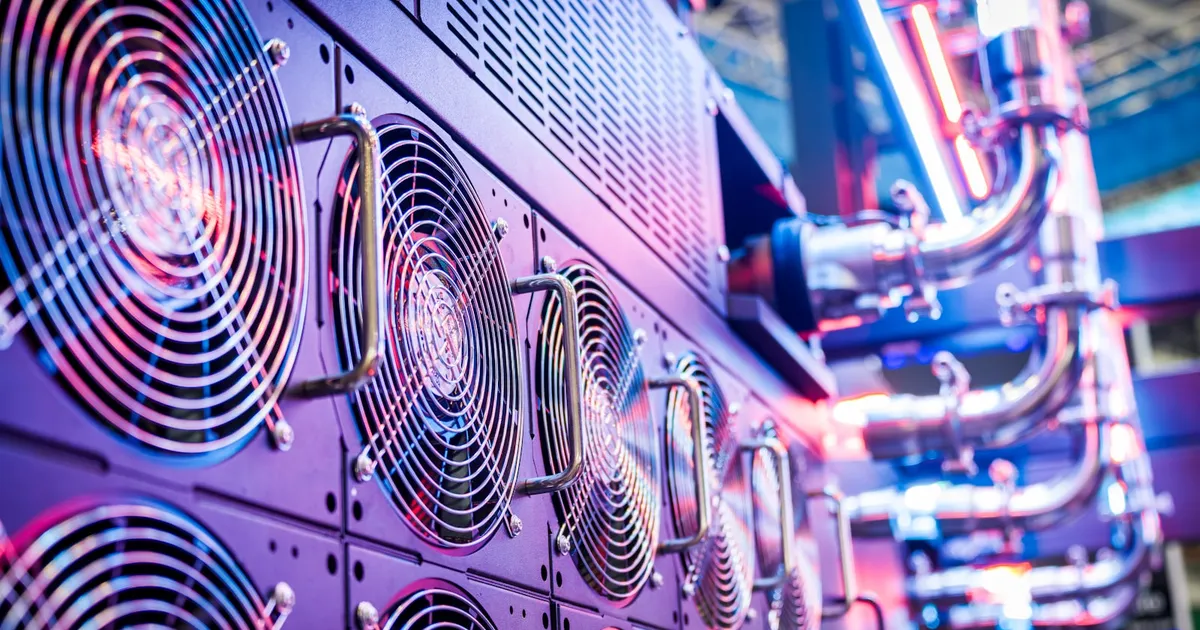 Rows of cooling fans in a data center hall, part of the infrastructure powering AI workloads