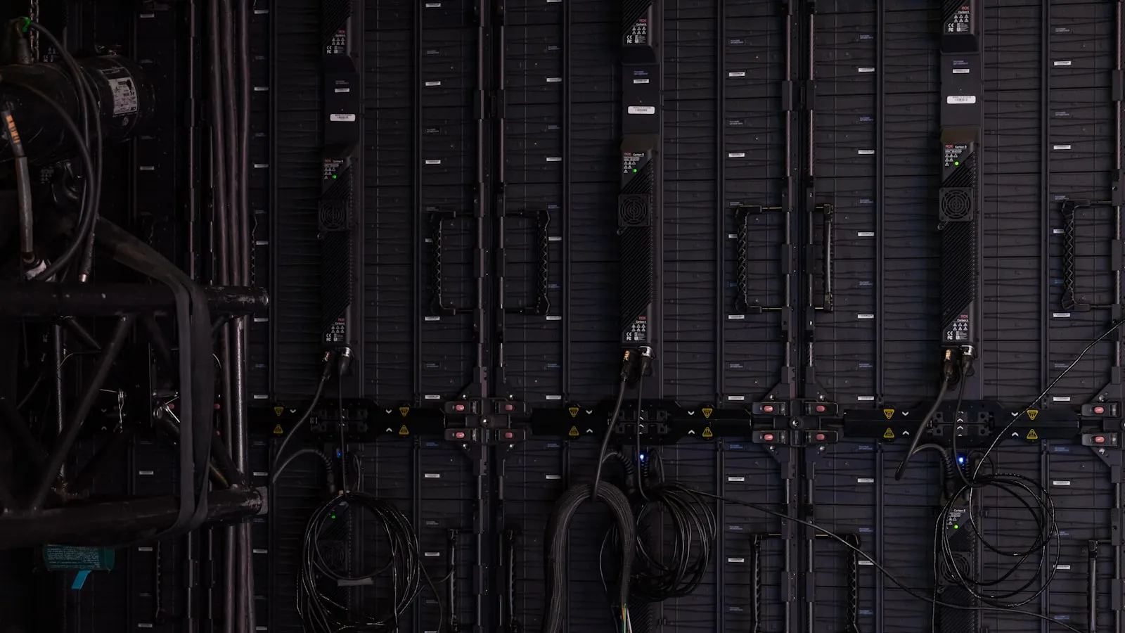 Rows of illuminated server racks in a data-center aisle