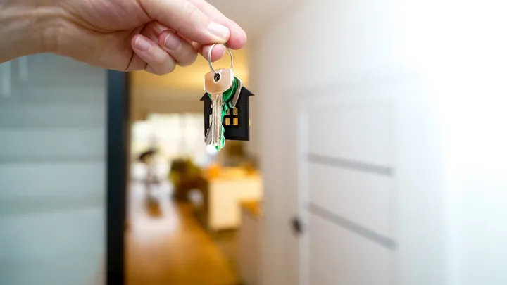 A set of house keys resting on a surface