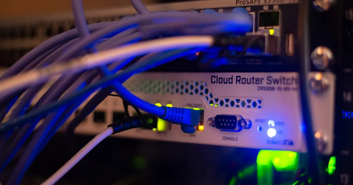 Networking cables plugged into a switch