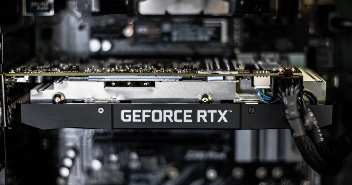 A GPU circuit board photographed in dark, low-key lighting