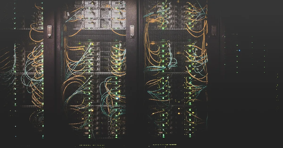 Densely cabled server racks in a data center, representing AI server infrastructure