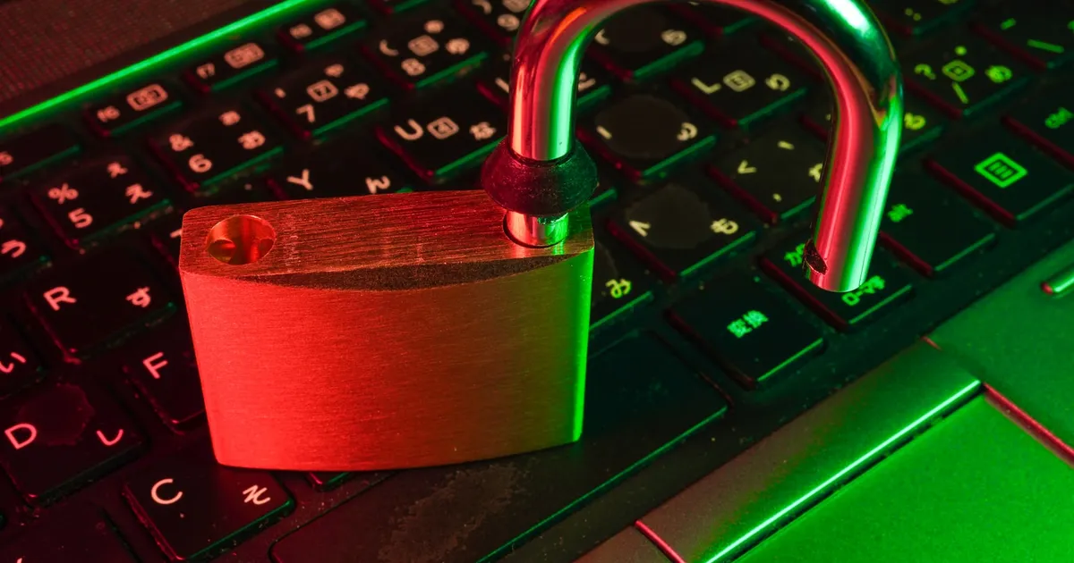 An unlocked padlock resting on a keyboard